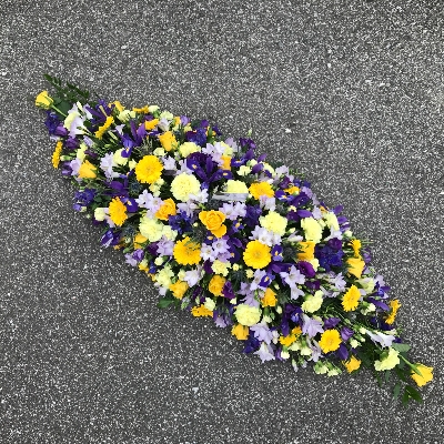 Yellow, purple, mauve, blue, coffin, casket, spray, funeral, tribute, wreath, flowers, Biggin Hill, Westerham, Orpington, Bromley, Sevenoaks, Florist 