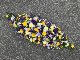 Yellow, purple, mauve, blue, coffin, casket, spray, funeral, tribute, wreath, flowers, Biggin Hill, Westerham, Orpington, Bromley, Sevenoaks, Florist 